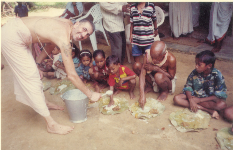 Distributing prasad... Distributing prasad...